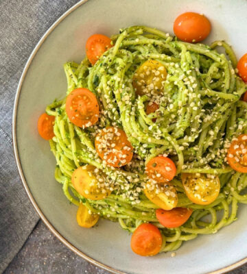 wild garlic and edamame pesto pasta with cherry tomatoes and hemp hearts