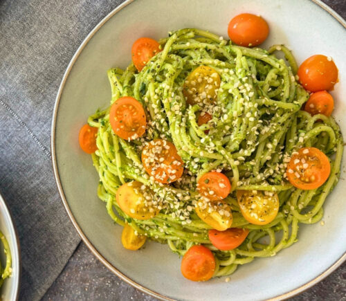 wild garlic and edamame pesto pasta with cherry tomatoes and hemp hearts