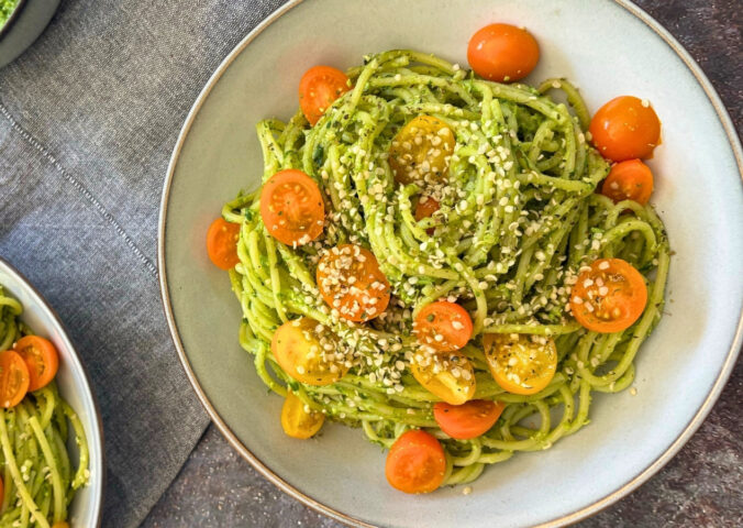 wild garlic and edamame pesto pasta with cherry tomatoes and hemp hearts
