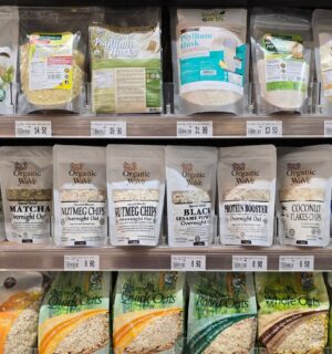 Organic superfoods displayed on a supermarket shelf to illustrate foods linked to tripling fiber intake