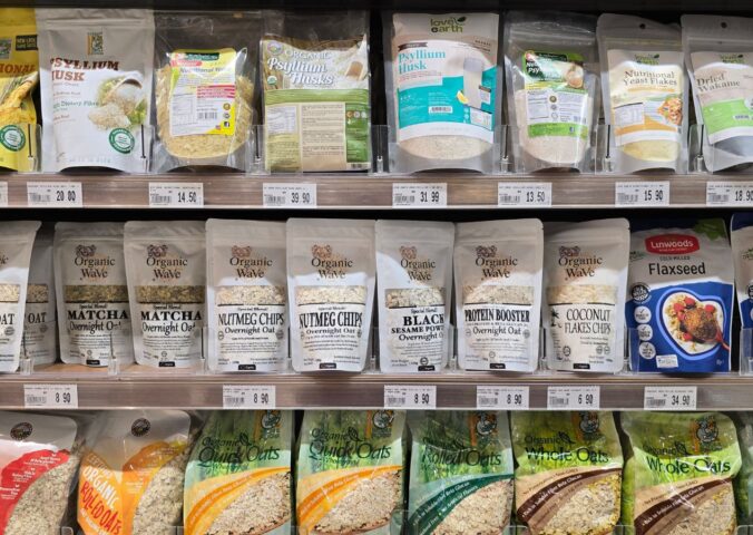 Organic superfoods displayed on a supermarket shelf to illustrate foods linked to tripling fiber intake
