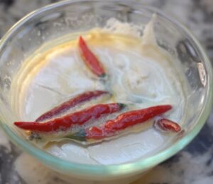 To make vegan yogurt from chilis, Miyoko adds whole Thai chilis to warm plant milk to ferment and create a starter culture