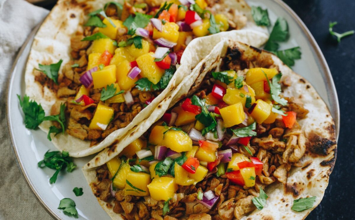chick'n with mango, onion, and lime on a tortilla for vegan mango recipes