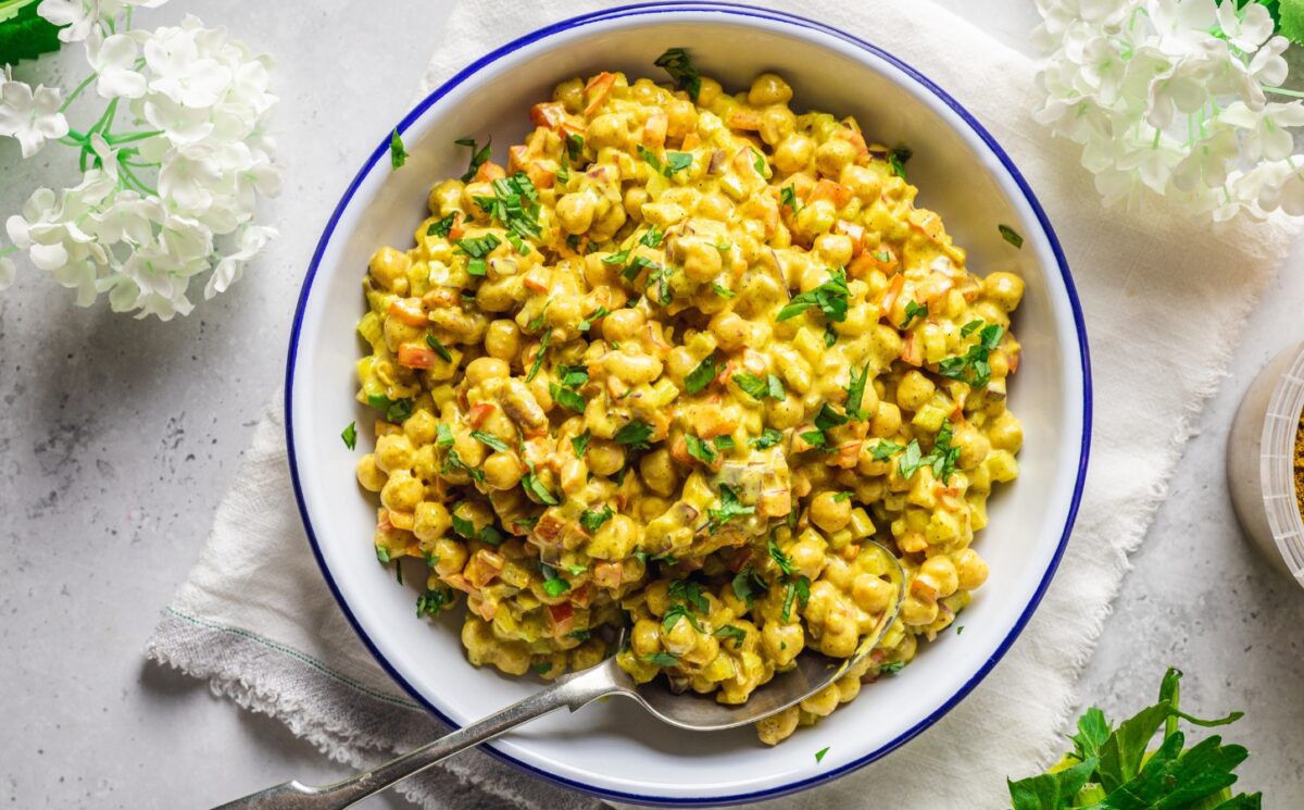 Vegan Curried Chickpea Salad with red onion, celery, red pepper, mayo, lemon, and curry powder for vegan summer side dishes