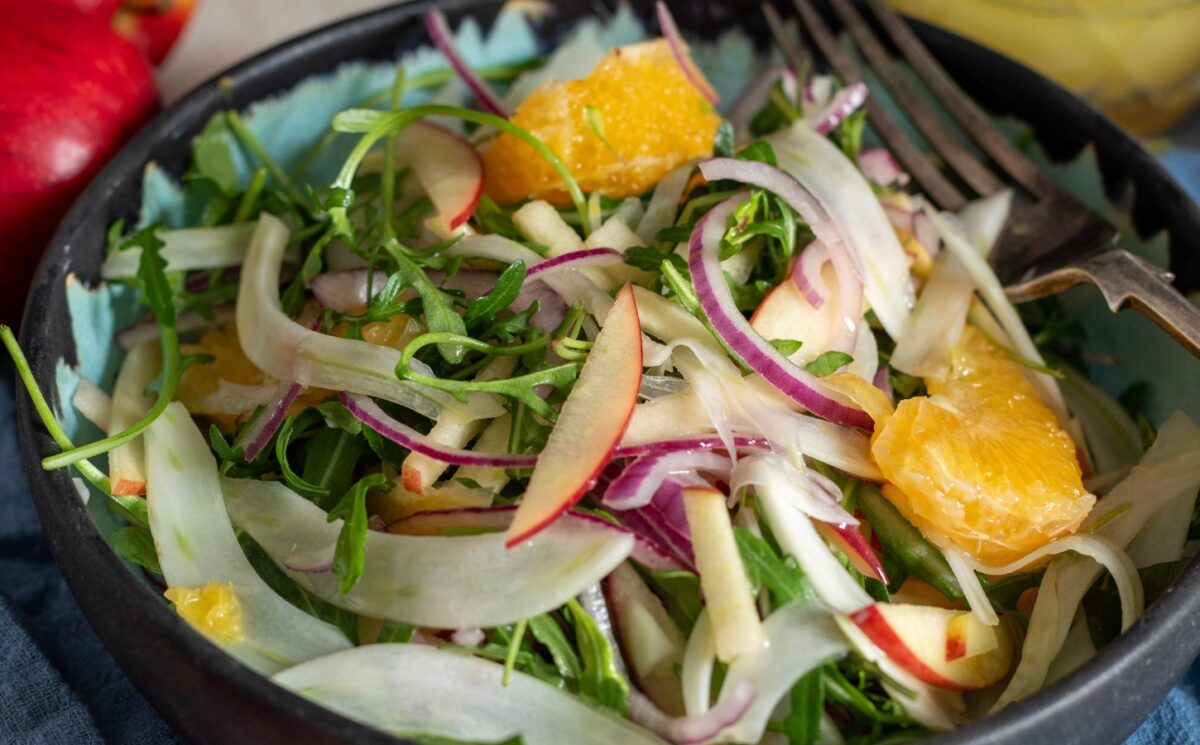 Apple, fennel and orange salad with a simple olive oil dressing for vegan summer salads