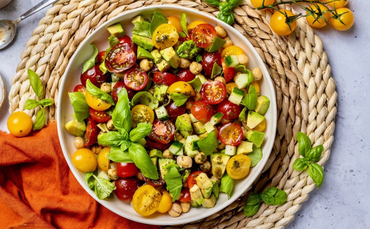 Fresh Cherry Tomato And Chickpea Salad with cucumber, avocado, basil, and lemon for vegan summer side dishes