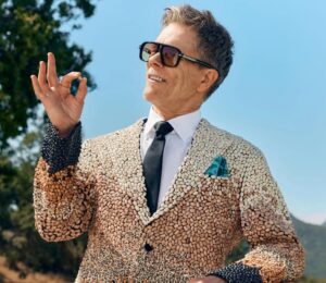 Photo shows Kevin Bacon holding up a single bean. Kevin Bacon has suggested swapping meat for beans on a Wednesday to improve your health, harm fewer animals, and protect the planet