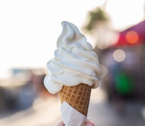 Photo shows someone's hand holding up a soft serve ice cream cone. A Legoland customer has said that a server at the park advised them that all of the soft serve ice cream is now made using a vegan mix from Flora