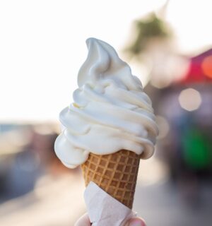 Photo shows someone's hand holding up a soft serve ice cream cone. A Legoland customer has said that a server at the park advised them that all of the soft serve ice cream is now made using a vegan mix from Flora