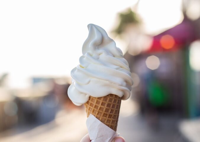 Photo shows someone's hand holding up a soft serve ice cream cone. A Legoland customer has said that a server at the park advised them that all of the soft serve ice cream is now made using a vegan mix from Flora