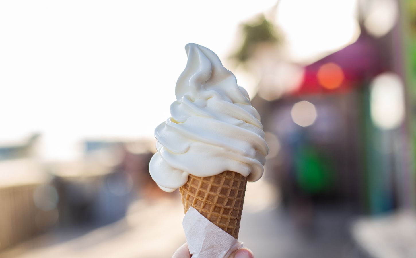 Photo shows someone's hand holding up a soft serve ice cream cone. A Legoland customer has said that a server at the park advised them that all of the soft serve ice cream is now made using a vegan mix from Flora
