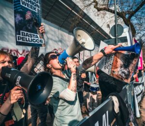 Photo shows CAFT protestors. CAFT has been protesting Milan Fashion Week's continued use of fur on the runway. The Lutech Group is the fifth and most recent company to drop its partnership with Milan Fashion Week over the issue.