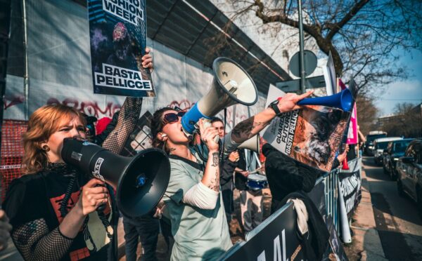 Photo shows CAFT protestors. CAFT has been protesting Milan Fashion Week's continued use of fur on the runway. The Lutech Group is the fifth and most recent company to drop its partnership with Milan Fashion Week over the issue.