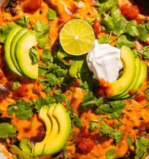 One-Pan Vegan Taco Skillet with avocado, lime, tortilla chips, vegan cheese, black beans and quinoa