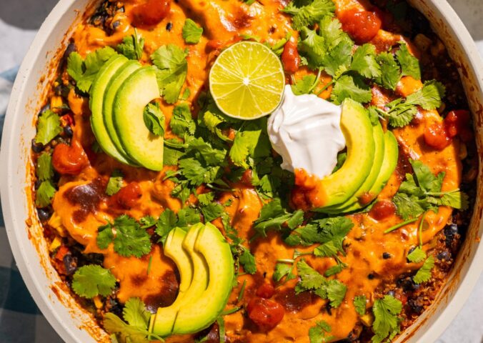 One-Pan Vegan Taco Skillet with avocado, lime, tortilla chips, vegan cheese, black beans and quinoa