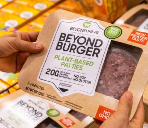 Photo shows someone's hands holding a pack of plant-based meat by Beyond Meat. The European Parliament has voted to ban a long list of “meaty” words from use on plant-based products and other alternatives