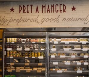 Photo shows the refrigerator inside a Pret cafe, including a sign that says, "freshly prepared, good, natural, food." Pret A Manger is facing a £1 million “Public Accountability Campaign” over its broken promise to stop selling “Frankenchickens” by 2026