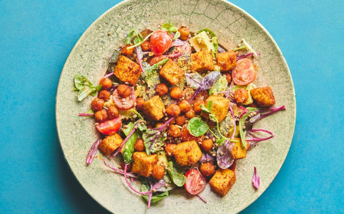 roasted chickpea and tofu salad with tomatoes, avocado, maple syrup, and tahini for vegan summer salads