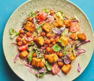 roasted chickpea and tofu salad with tomatoes, avocado, maple syrup, and tahini for vegan summer salads