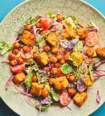 roasted chickpea and tofu salad with tomatoes, avocado, maple syrup, and tahini for vegan summer salads