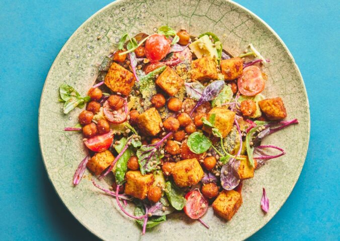 roasted chickpea and tofu salad with tomatoes, avocado, maple syrup, and tahini for vegan summer salads
