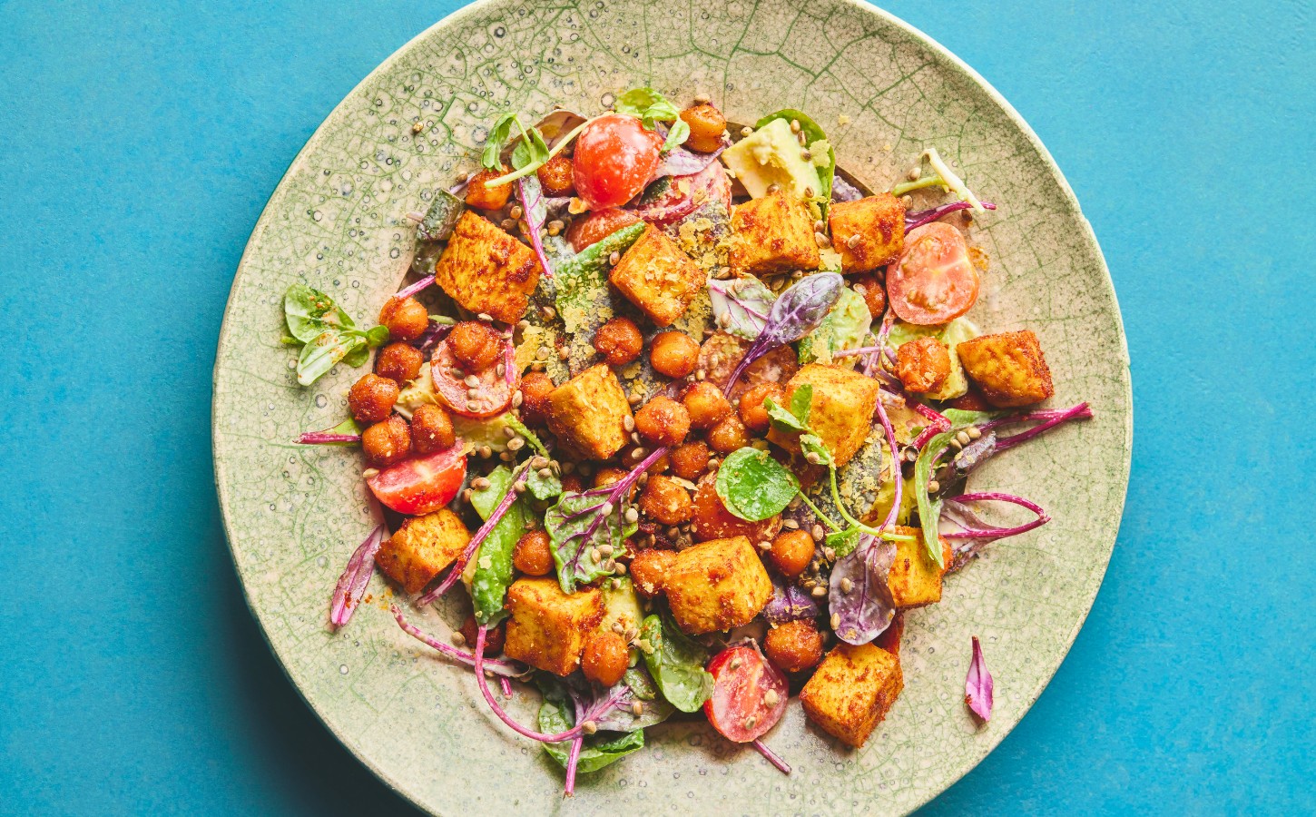roasted chickpea and tofu salad with tomatoes, avocado, maple syrup, and tahini for vegan summer salads