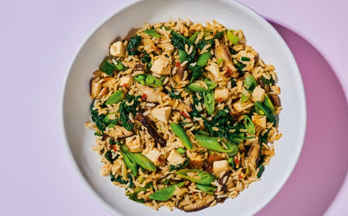 Shiitake And Smoked Tofu Fried Rice with chili bean paste, smoked tofu, baby spinach, ands snap peas