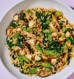 Shiitake And Smoked Tofu Fried Rice with chili bean paste, smoked tofu, baby spinach, ands snap peas