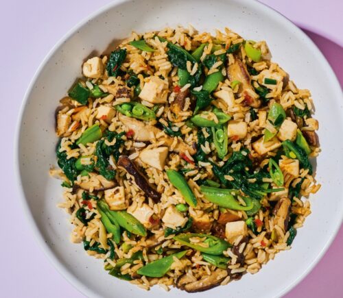 Shiitake And Smoked Tofu Fried Rice with chili bean paste, smoked tofu, baby spinach, ands snap peas