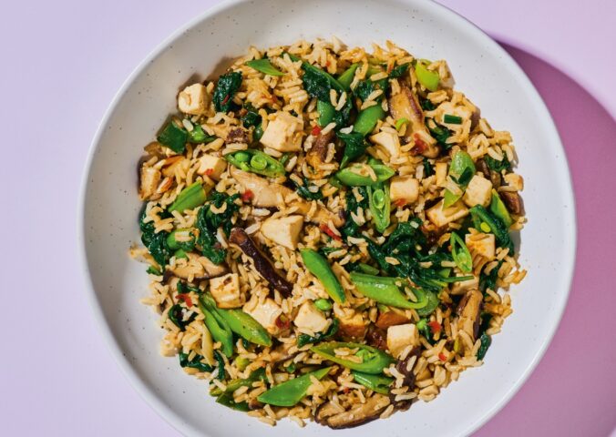 Shiitake And Smoked Tofu Fried Rice with chili bean paste, smoked tofu, baby spinach, ands snap peas