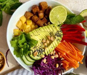 Summer Roll Bowl with tempeh, rice noodles, peppers, cabbage, and carrot