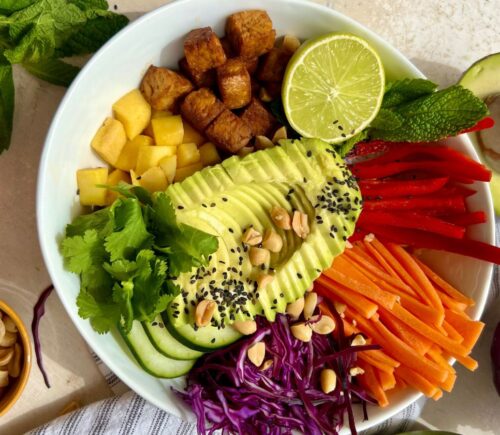 Summer Roll Bowl with tempeh, rice noodles, peppers, cabbage, and carrot