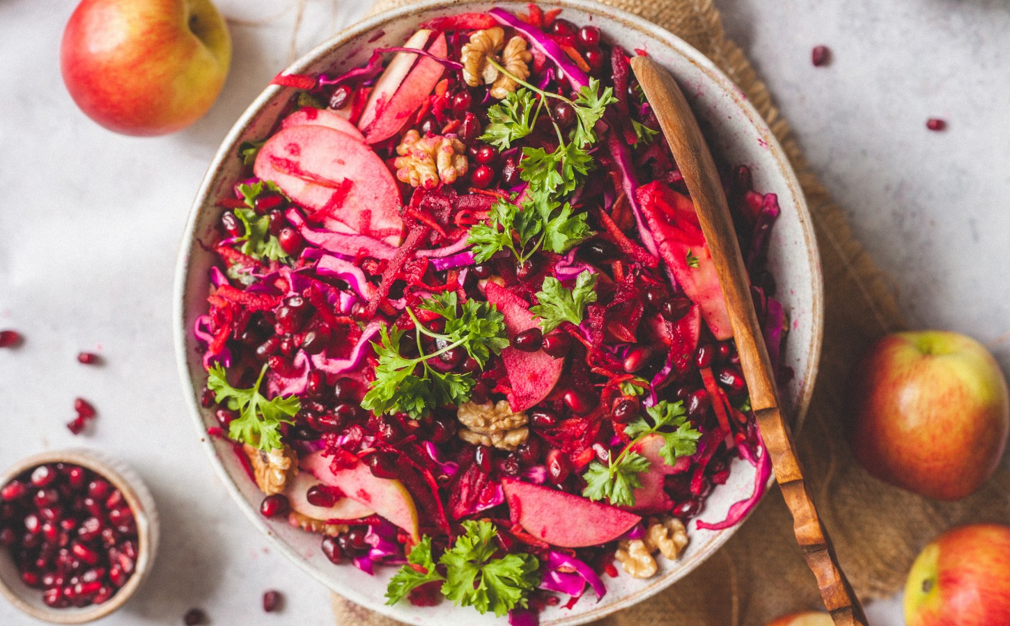 Superfood Apple Beet Salad with red cabbage, carrots, beetroot, walnuts, chia seeds, and parsley