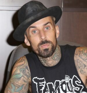 Photo shows Blink 182 drummer Travis Barker signing a book. Travis Barker has joined Mr Charlie’s, sometimes known as the “vegan McDonald’s,” as an equity partner and brand ambassador