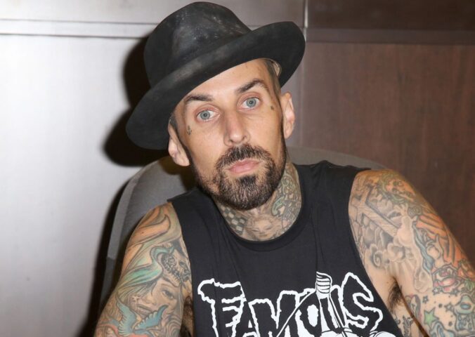 Photo shows Blink 182 drummer Travis Barker signing a book. Travis Barker has joined Mr Charlie’s, sometimes known as the “vegan McDonald’s,” as an equity partner and brand ambassador