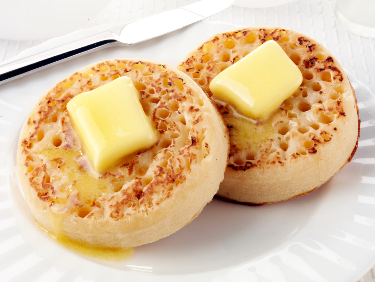 Photo shows two crumpets with butter melting on them. Warburtons has introduced vegan pizza-flavored crumpets