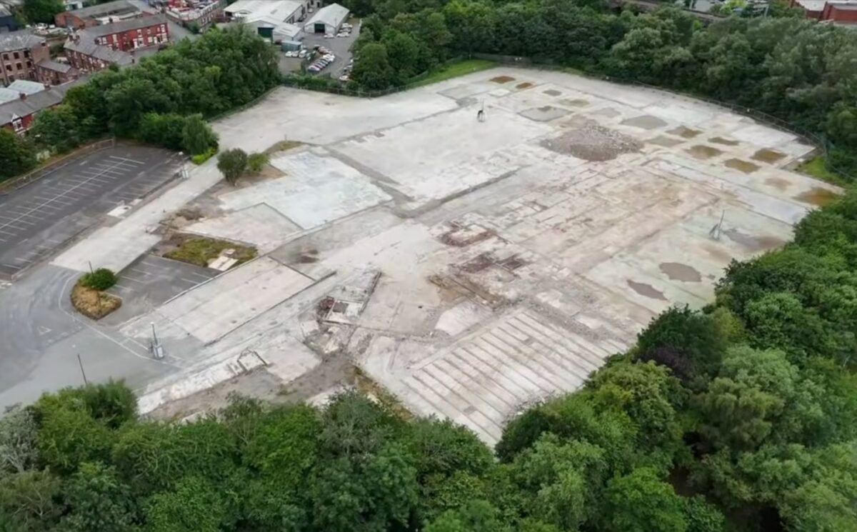Aerial view of the demolished Ashton-under-Lyne slaughterhouse site, showing the flattened area where the UK pig gas chamber demolished after the facility’s closure once operated