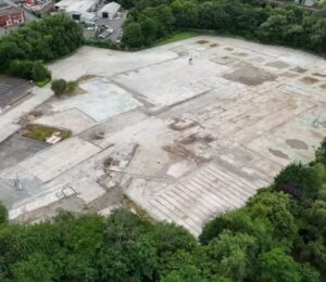 Aerial view of the demolished Ashton-under-Lyne slaughterhouse site, showing the flattened area where the UK pig gas chamber demolished after the facility’s closure once operated