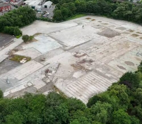 Aerial view of the demolished Ashton-under-Lyne slaughterhouse site, showing the flattened area where the UK pig gas chamber demolished after the facility’s closure once operated