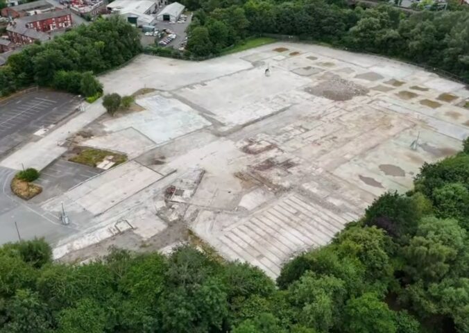 Aerial view of the demolished Ashton-under-Lyne slaughterhouse site, showing the flattened area where the UK pig gas chamber demolished after the facility’s closure once operated