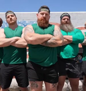 The vegan team stands with arms crossed before competing in a vegans vs meat eaters strength challenge organized by fitness YouTuber Brandon William