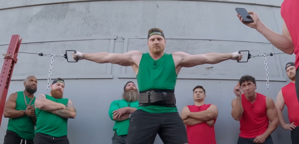Vegan athlete Brady competes in the Hercules hold during the vegans vs meat eaters strength challenge