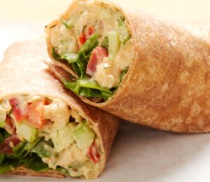 Apple-Dill Chickpea Mash Wrap with celery, bell pepper, red onion, mayo, and mustard