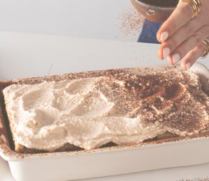 a dish full of cheat's tiramisu, a high-protein and plant-based dessert for vegan tiramisu recipes