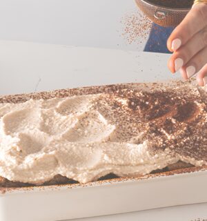 a dish full of cheat's tiramisu, a high-protein and plant-based dessert for vegan tiramisu recipes