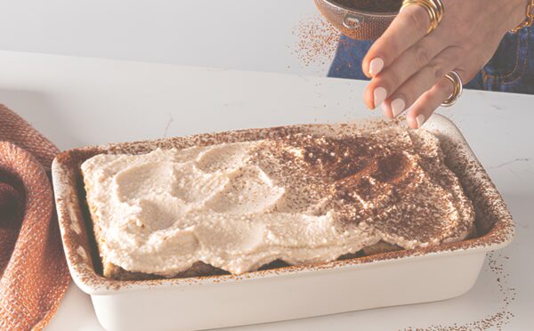 a dish full of cheat's tiramisu, a high-protein and plant-based dessert for vegan tiramisu recipes