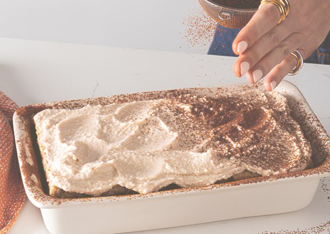 a dish full of cheat's tiramisu, a high-protein and plant-based dessert for vegan tiramisu recipes