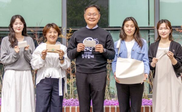 Photo shows Kim Jae-wook, the Chilgok County Governor, with employees of the Chilgok County Agricultural Technology Center, all holding vegan certified leather products made from upcycled melons. Chilgok County in South Korea has begun upcycling melon waste into vegan leather