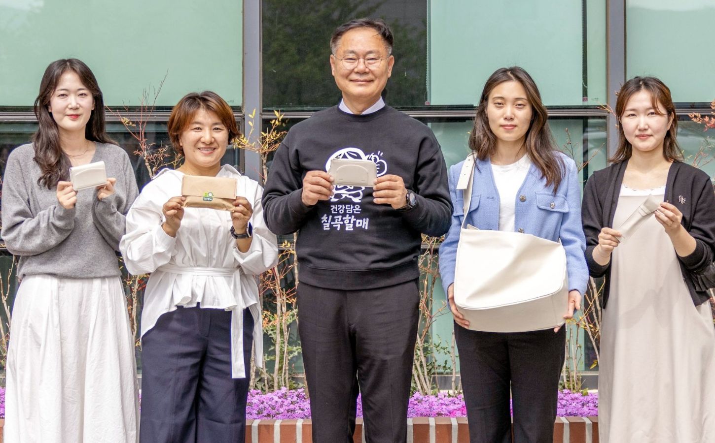 Photo shows Kim Jae-wook, the Chilgok County Governor, with employees of the Chilgok County Agricultural Technology Center, all holding vegan certified leather products made from upcycled melons. Chilgok County in South Korea has begun upcycling melon waste into vegan leather