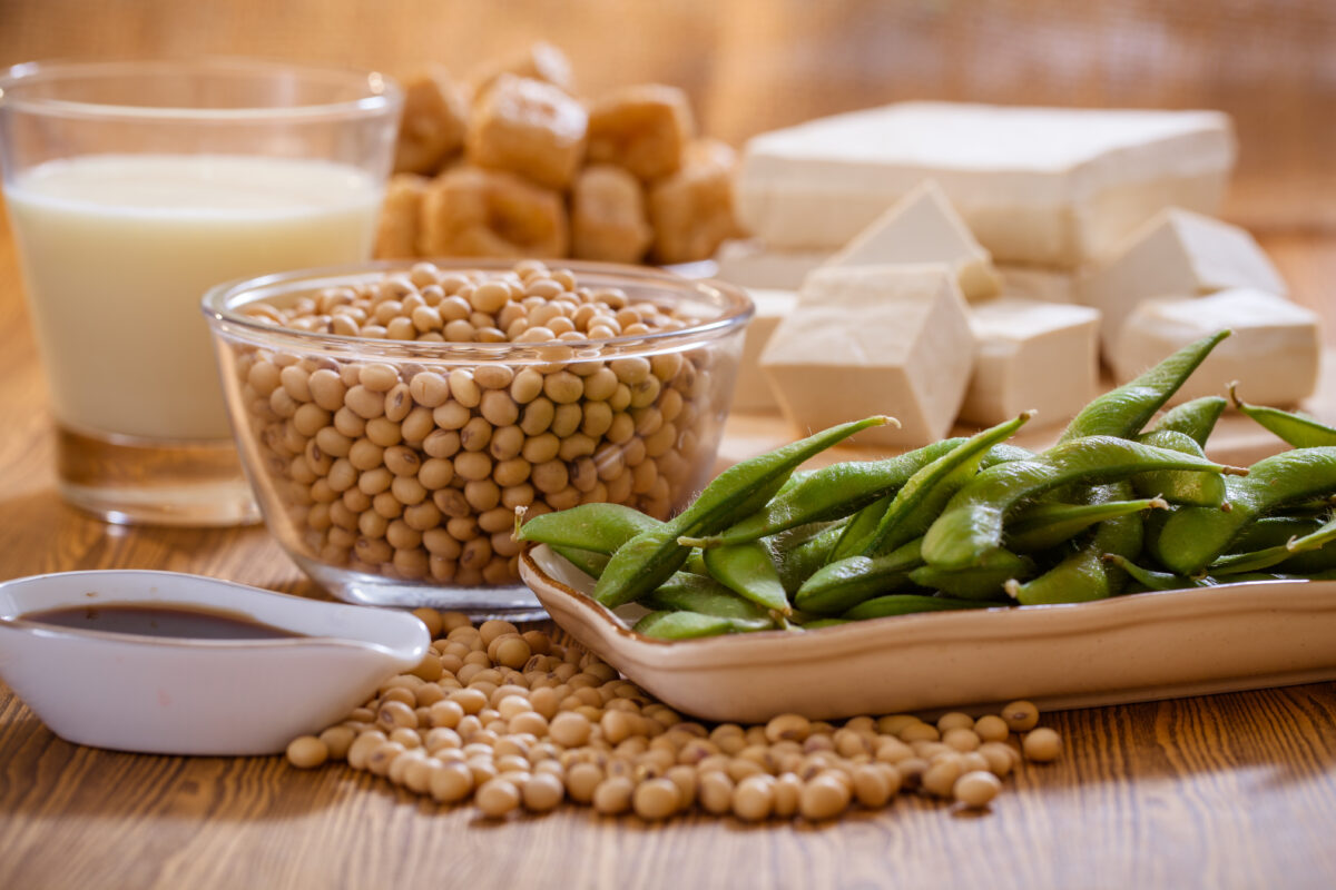 Photo shows a selection of soy products, including tofu, milk, beans, soy sauce, and edamame beans